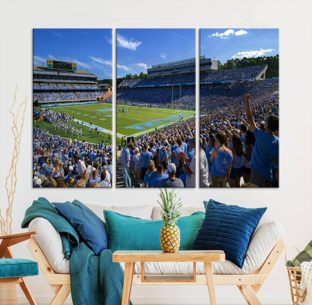 A gallery-quality canvas wall art print featuring the University of North Carolina Tar Heels Football Team and Chapel Hill's Kenan Memorial Stadium adorns the cafe wall.