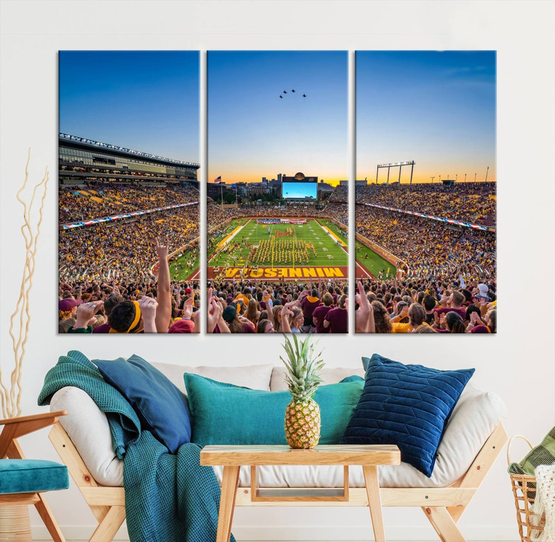 Canvas wall art featuring the University of Minnesota Football Team print, showcasing Huntington Bank Stadium at sunset with jets overhead.