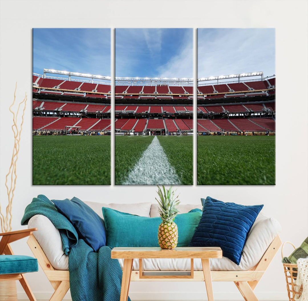 A canvas print of the University of Tulsa Golden Hurricane showcases H.A. Chapman Stadiums football field and red seats against a backdrop of a blue sky.