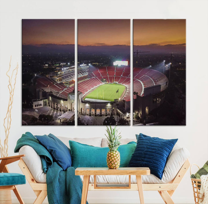 The USC Trojans Stadium canvas captures Memorial Coliseum at twilight, showcasing red seats and a green field beneath an orange sky.