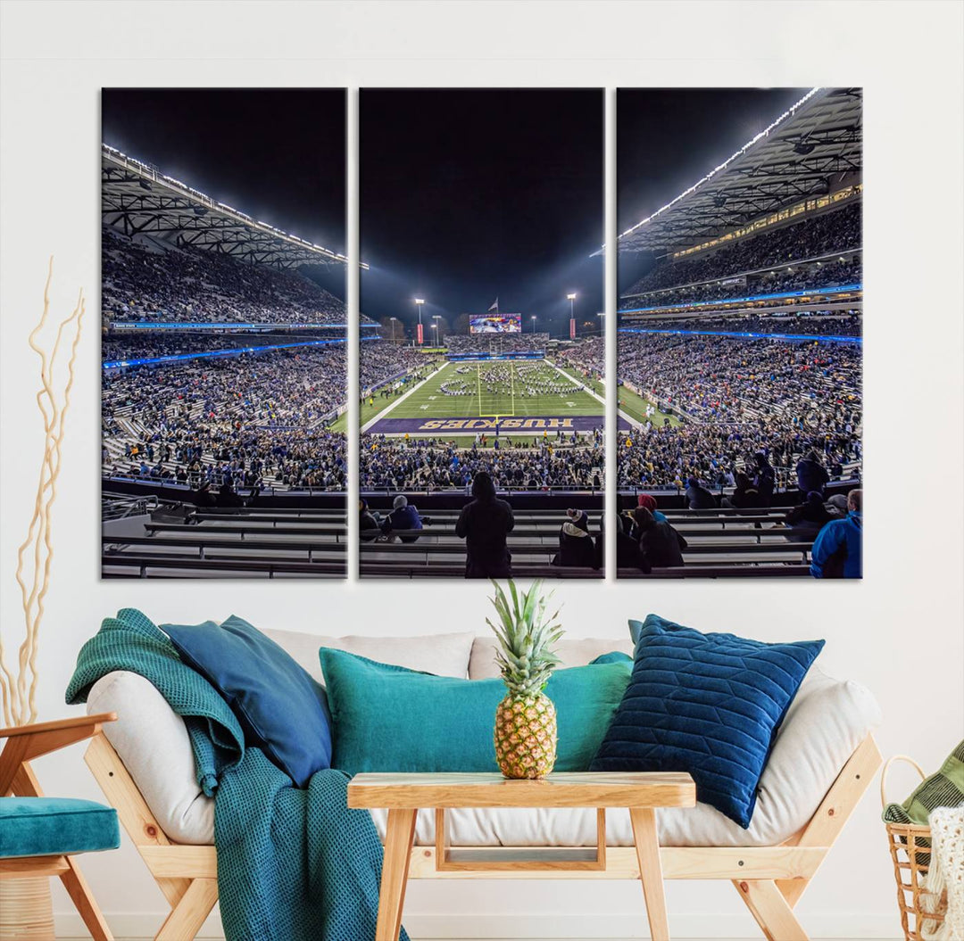 A canvas print titled The University of Washington Huskies Football depicts a packed Husky Stadium at night, as seen from the stands.