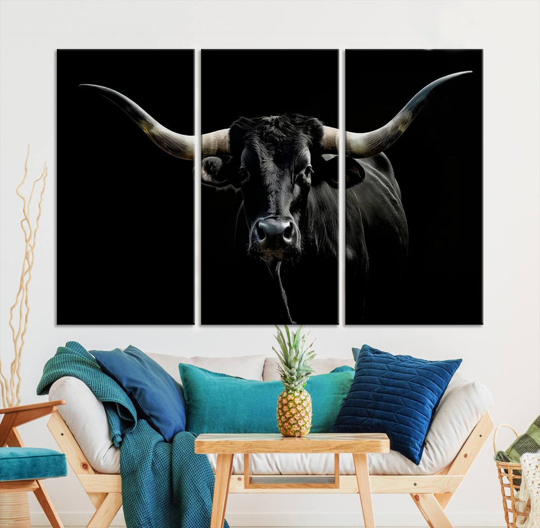 The Texas Black Longhorn Bull Canvas Print, featuring large curved horns set against a dark background, is ideal for Western decor.