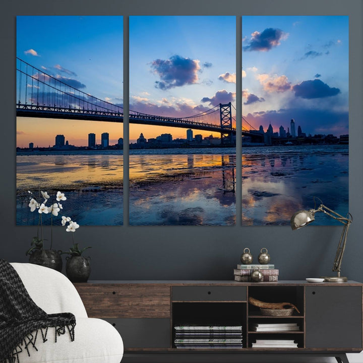 A photograph titled "Large Wall Art Philadelphia Canvas Print - Benjamin Franklin Bridge at Sunset" displays a breathtaking cityscape of the bridge reflected in the water. This image features a gallery-quality finish that promises to transform any space into an evocative memory.