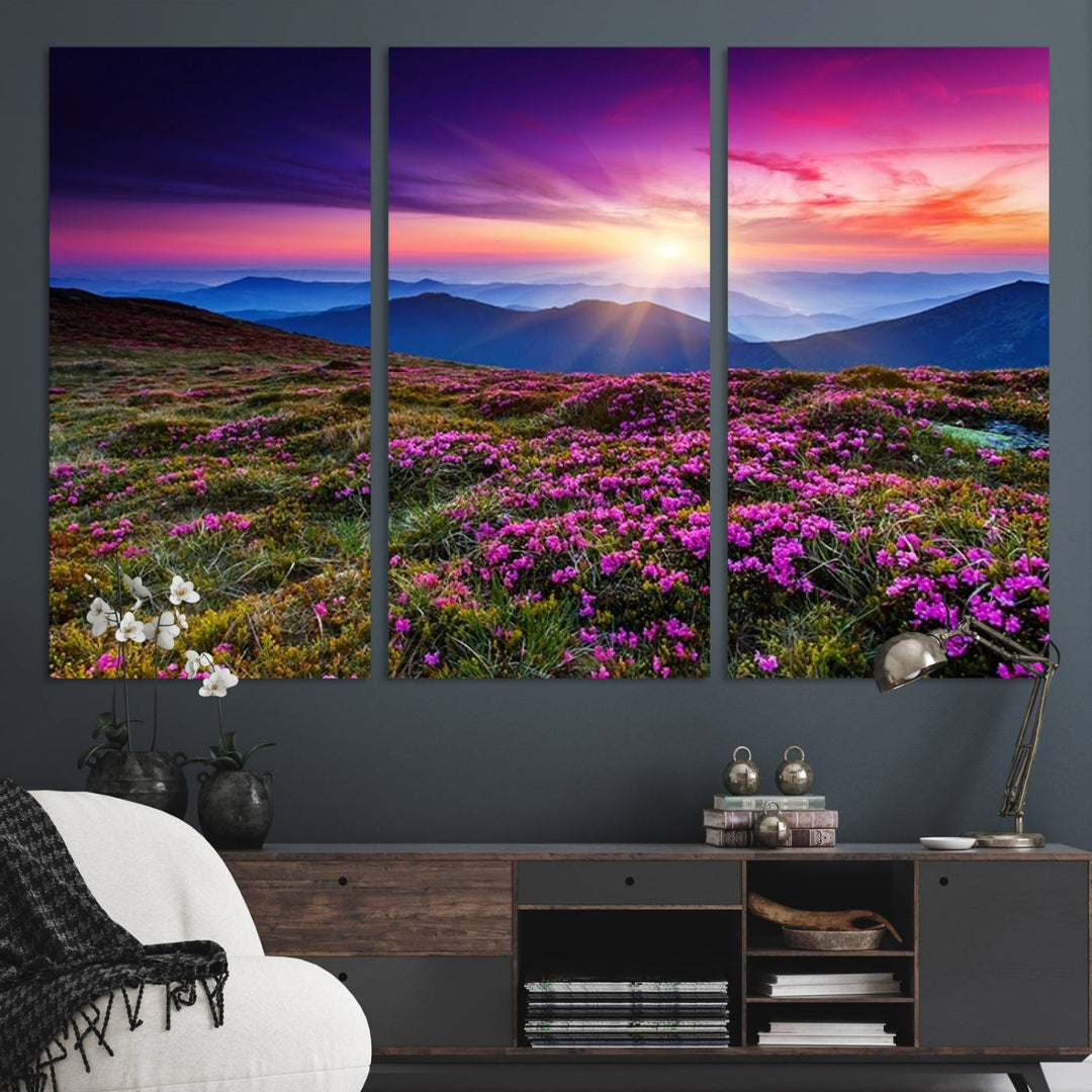 A 3-panel landscape photography canvas of a sunset over mountain meadows with purple wildflowers decorates the wall.