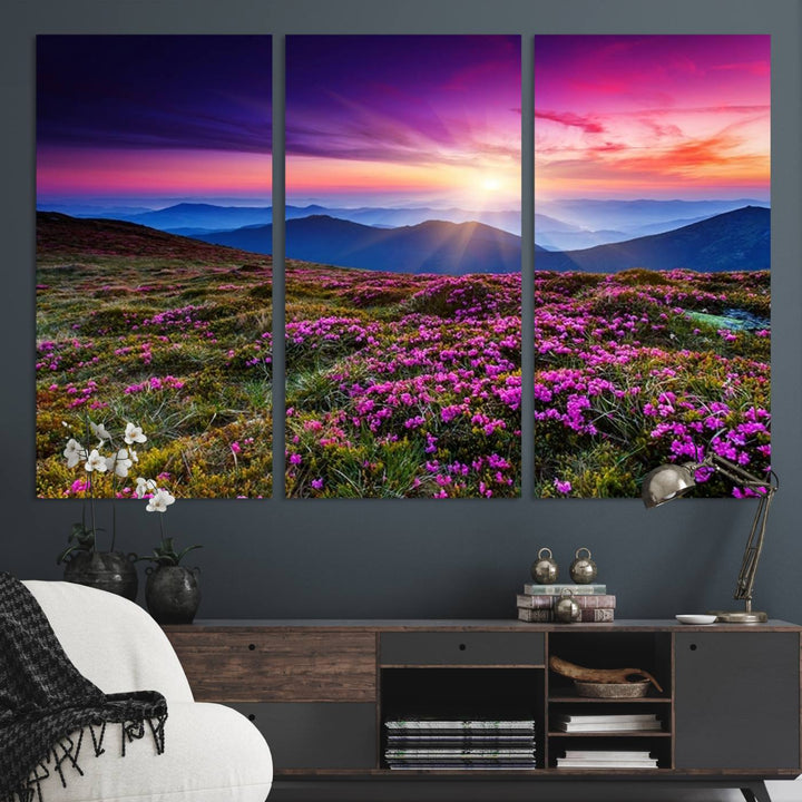 A 3-panel landscape photography canvas of a sunset over mountain meadows with purple wildflowers decorates the wall.