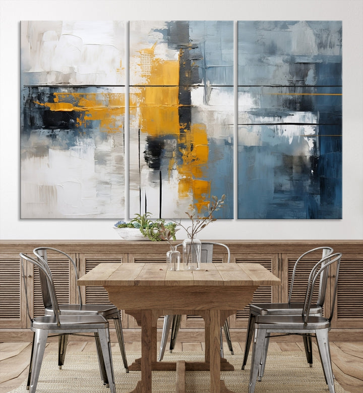 The Orange Abstract Wall Art Print features a series of white, blue, black, and yellow blocks arranged in a triptych format on museum-quality canvases. Proudly made in the USA and offered with free shipping.