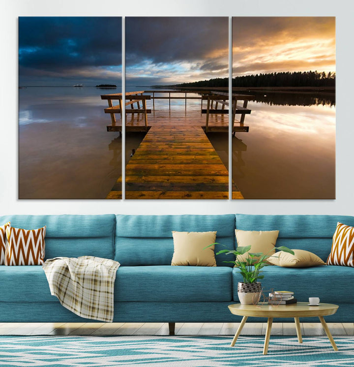 The "Serene Lake Pier at Sunset" landscape canvas print, crafted as ready-to-hang and framed wall art, enriches the contemporary setting by capturing the tranquility of a lakeside pier at sunset.