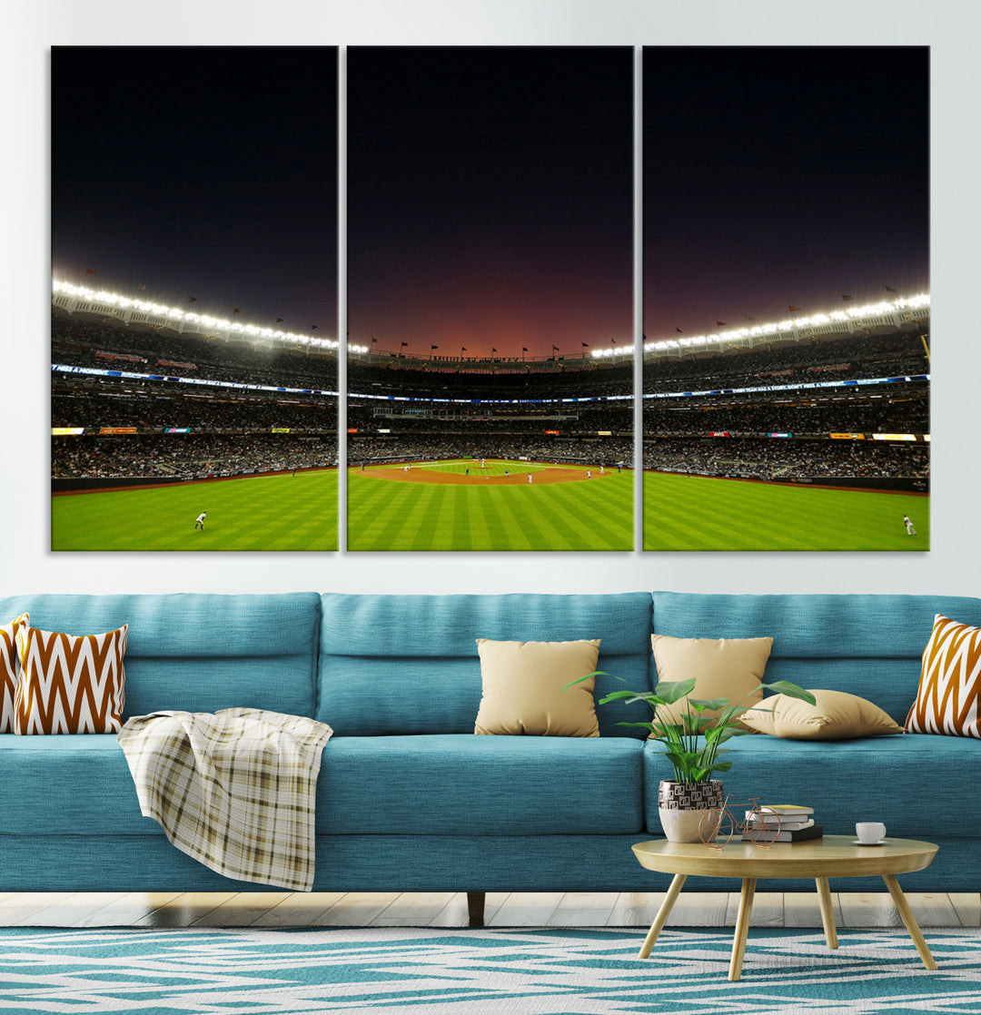 A night game at Yankee Stadium depicted on canvas beneath a sunset sky.