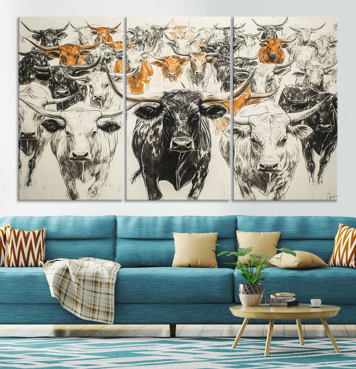 This exquisite farmhouse wall art, titled "Western Longhorn Cattle Canvas Print," showcases a majestic herd of longhorn cattle in a three-panel design. This ready-to-hang and framed barn decor infuses your space with rustic charm.