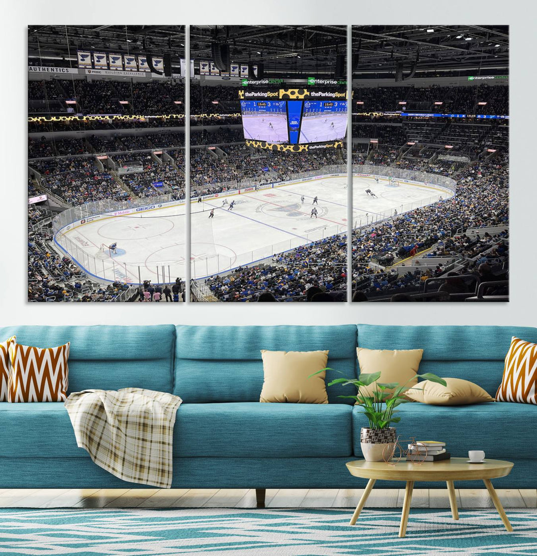 A large Enterprise Center canvas of a crowded hockey arena hangs prominently.