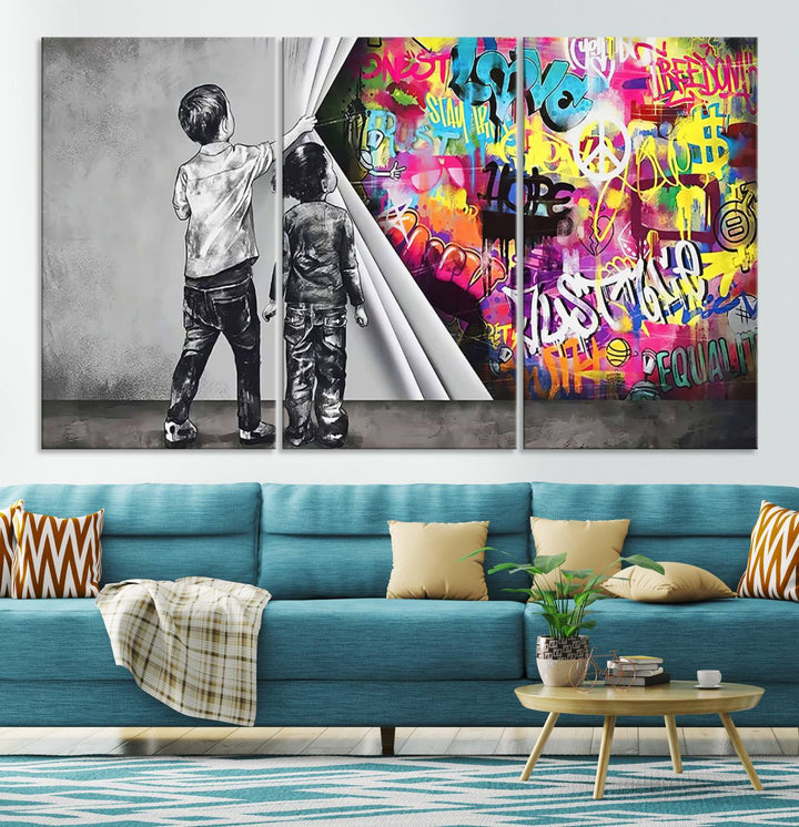 The Banksy Print - Street Art Canvas features a vibrant and bold image of two children lifting a curtain to reveal colorful graffiti. It's ready to hang, adding an urban modern decor vibe.