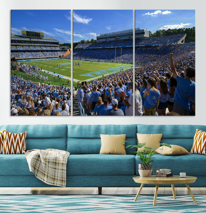 A gallery-quality canvas wall art print featuring the University of North Carolina Tar Heels Football Team and Chapel Hill's Kenan Memorial Stadium adorns the cafe wall.