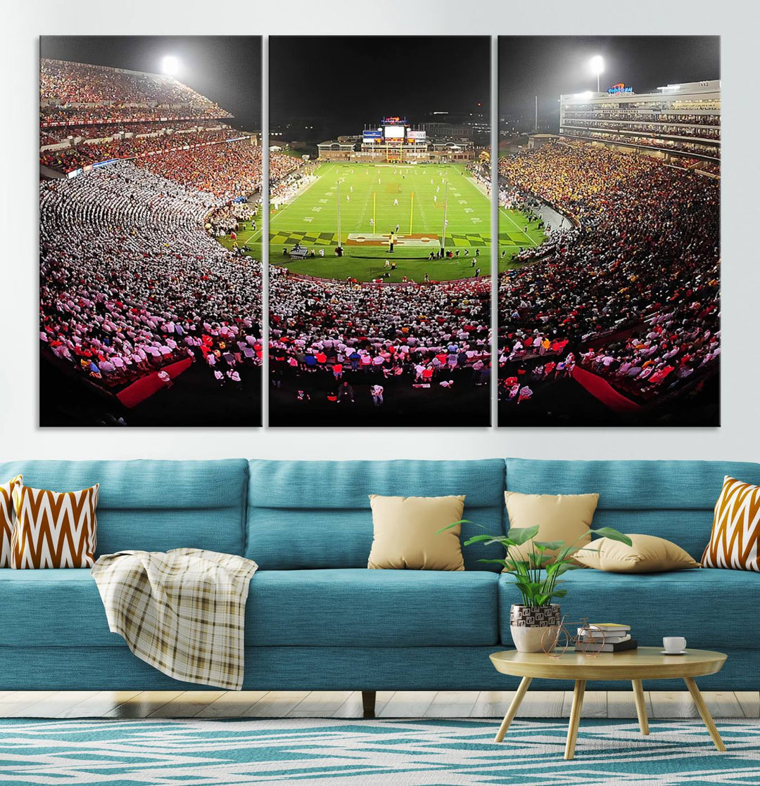 The Maryland Terrapins Football Wall Art Canvas showcases a packed SECU Stadium at night with a bright field and cheering fans.