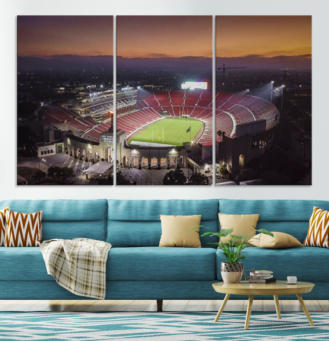 The USC Trojans Stadium canvas captures Memorial Coliseum at twilight, showcasing red seats and a green field beneath an orange sky.