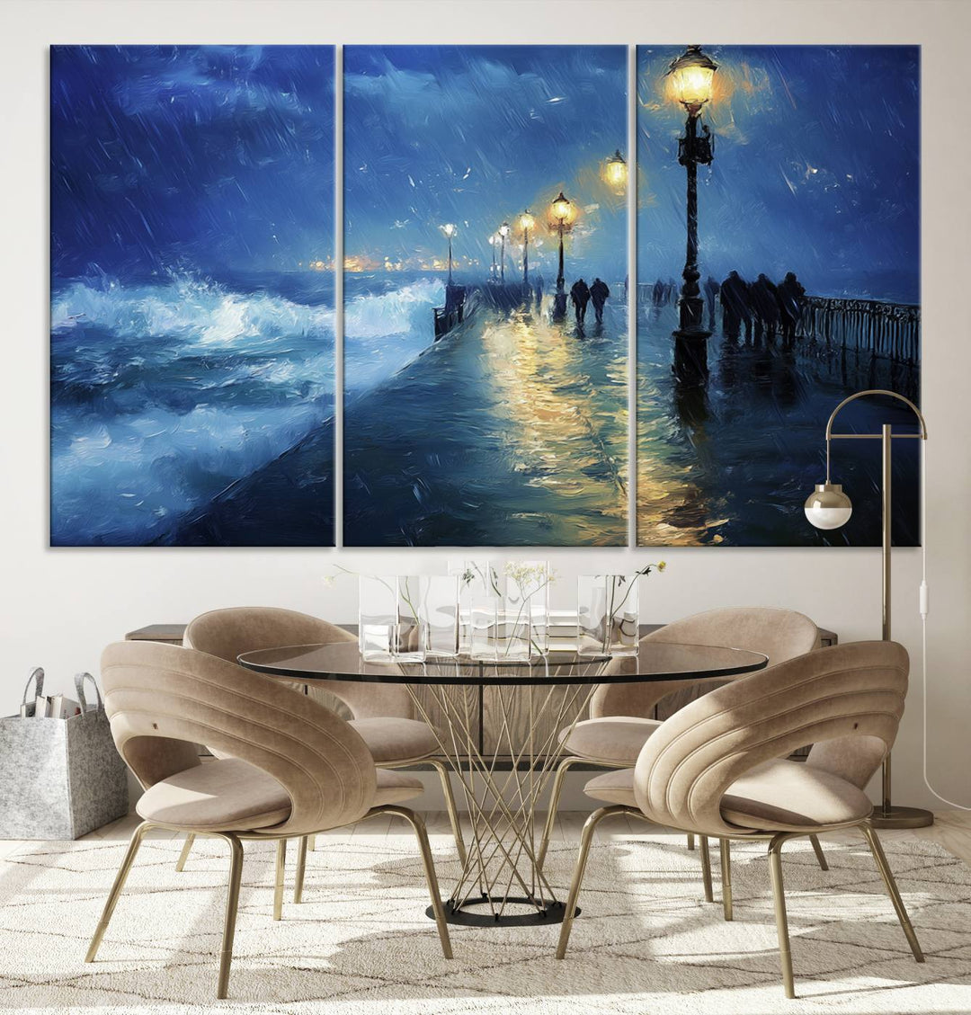 The Abstract Stormy Ocean Pier Canvas Wall Art Print showcases a moody night scene with figures on a lit promenade by the ocean. This stormy ocean art piece adds drama and captures nature's raw beauty against a serene evening backdrop.