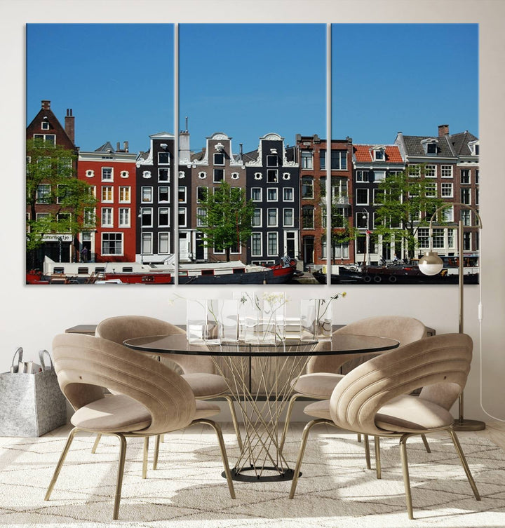 The Amsterdam City Wall Art Canvas Print showcases colorful traditional canal houses and boats set against a clear blue sky.