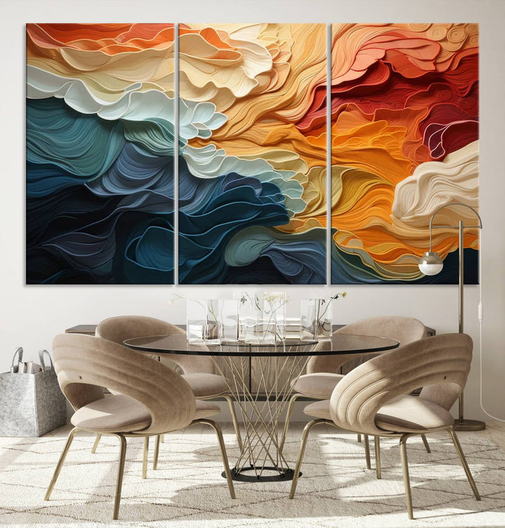 A Blue Orange Abstract Wave Wall Art Canvas Print adorns the wall. This colorful masterpiece is professionally hand-assembled to enhance any space.