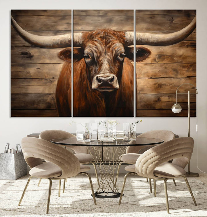 The Longhorn Bull Wall Art, a ready-to-hang canvas print, showcases an image of a brown longhorn cow set against a wooden background, perfect for those looking to enhance their space with rustic farmhouse and western barn decor.