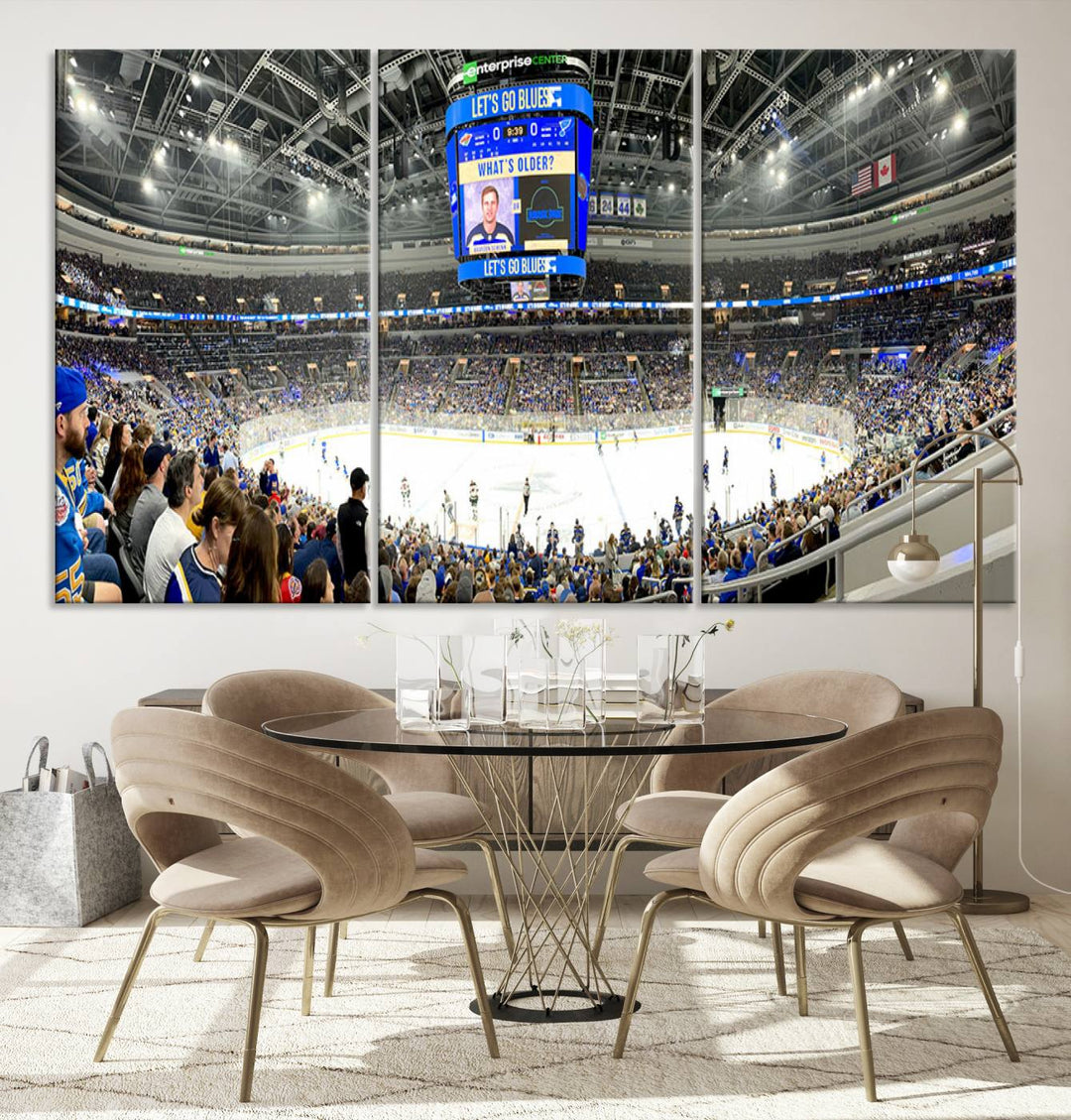 Wall art prints depicting the bustling scenes of the St. Louis Blues being cheered on by a full house at the Enterprise Center, beneath a large scoreboard.