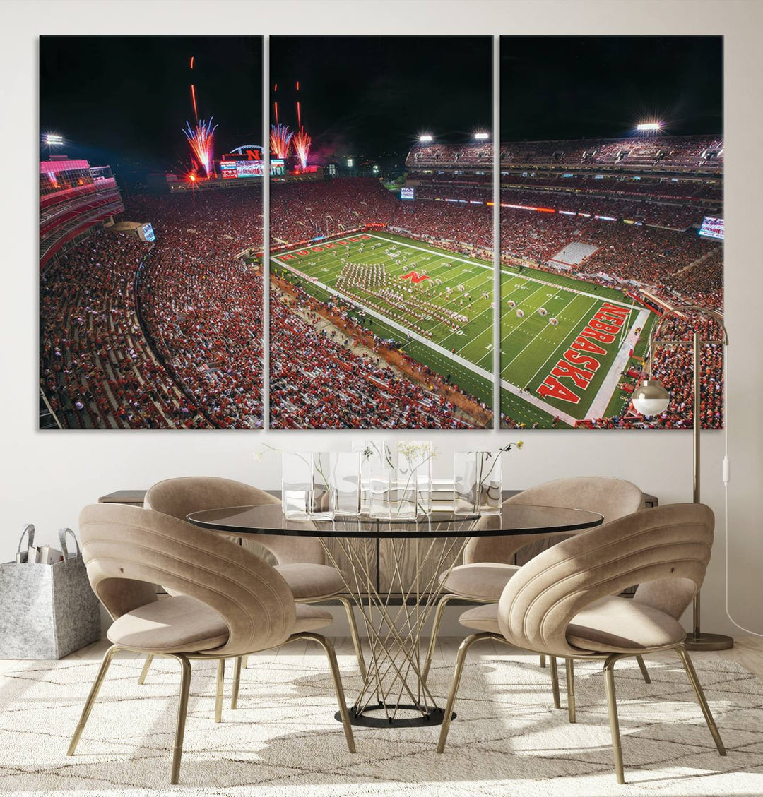 The University of Nebraska Cornhuskers Football Team Print, featuring Lincoln Memorial Stadium in a vibrant triptych canvas with fireworks above and a gallery-quality finish, is elegantly displayed.