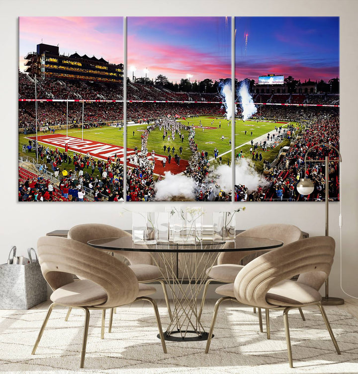 The wall art features a canvas print of the Stanford Cardinal football team, capturing players, fireworks, and smoke against the backdrop of a sunset at Stanford Stadium.