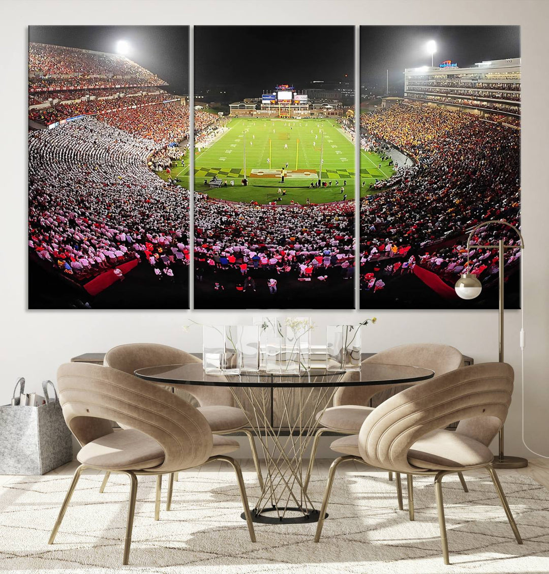 The Maryland Terrapins Football Wall Art Canvas showcases a packed SECU Stadium at night with a bright field and cheering fans.