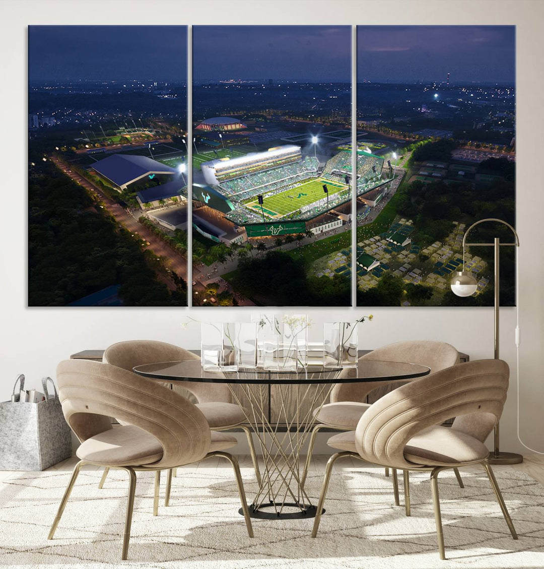 The USF Bulls Football Team Wall Art Canvas Print showcases the Tampa USF Football Stadium at night with city lights.