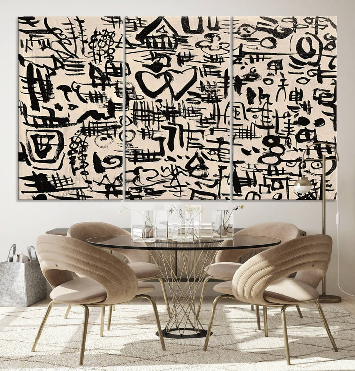 The Abstract Love and Chaos canvas is a museum-quality print featuring black symbols on a beige background, adorned with a heart and scribble design. It is framed to enhance its artistic appeal.