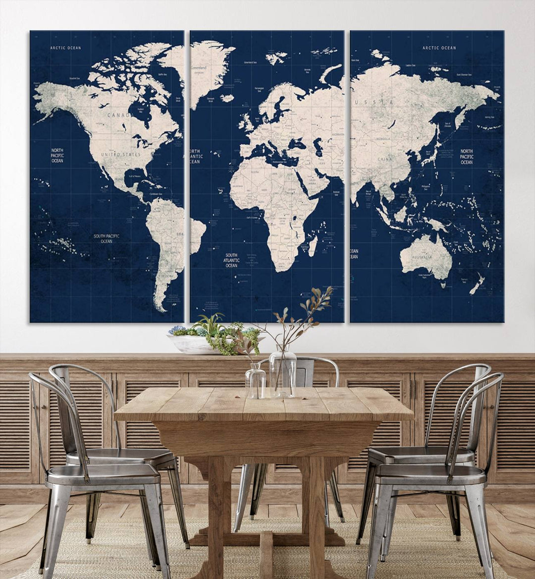 Large modern world map wall art canvas print in beige and navy; showcases a 3-panel vintage map design and is ready to hang.