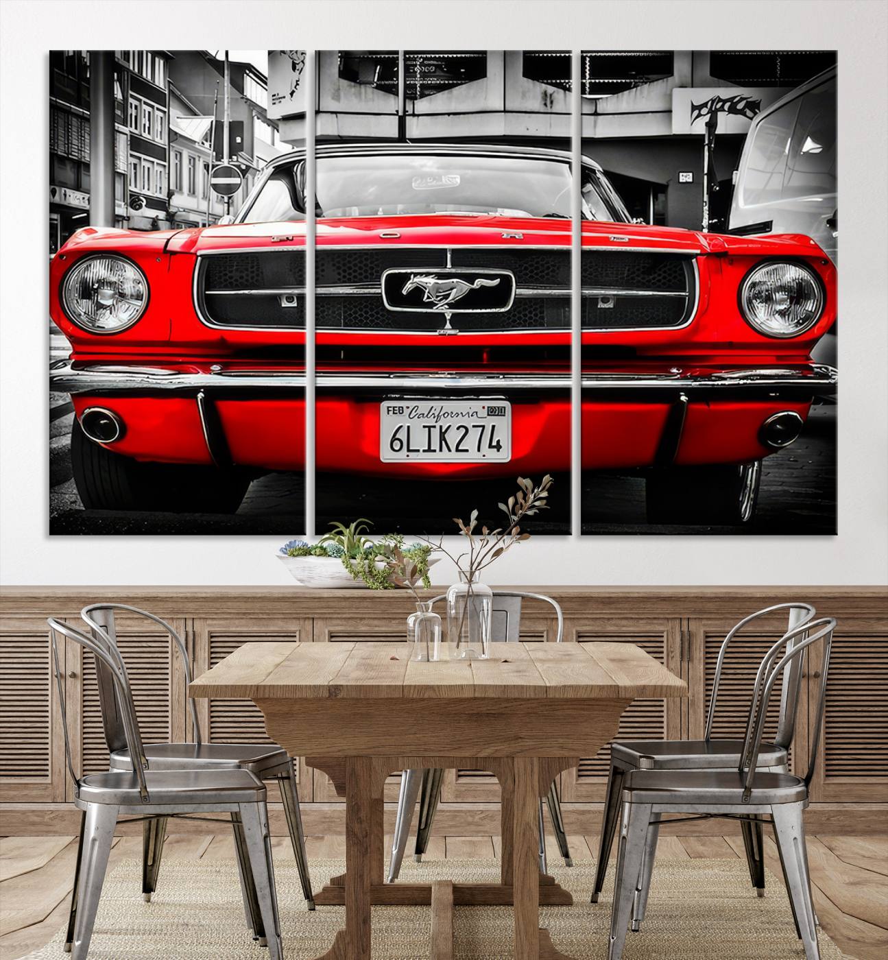 Front view of a bold red 1960s Ford Mustang parked in an urban environment, captured in dramatic contrast with a black-and-white city backdrop, emphasizing its timeless American muscle car identity.