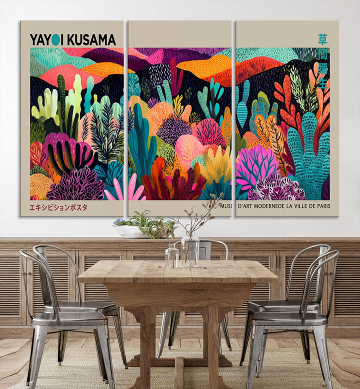 The framed Yayoi Kusama wall art adds vibrancy above the blue couch.