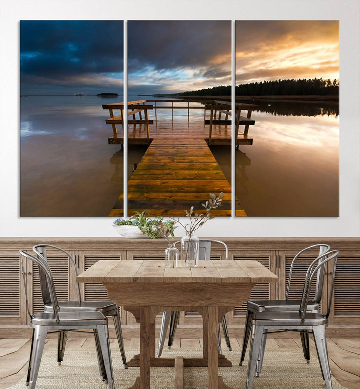 The "Serene Lake Pier at Sunset" landscape canvas print, crafted as ready-to-hang and framed wall art, enriches the contemporary setting by capturing the tranquility of a lakeside pier at sunset.