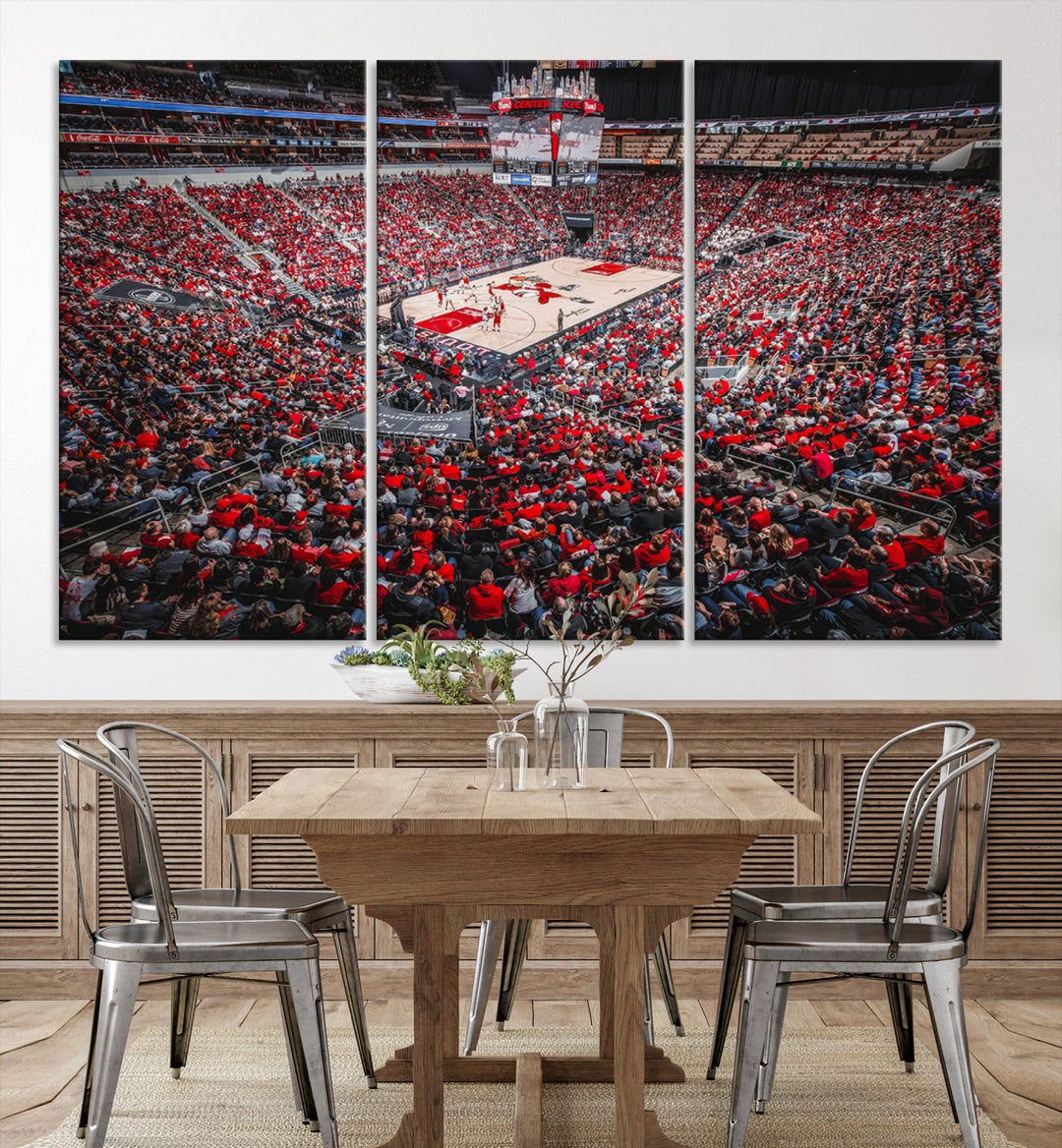 A painting of Louisville Cardinals fans in red at the KFC Yum Center Arena.