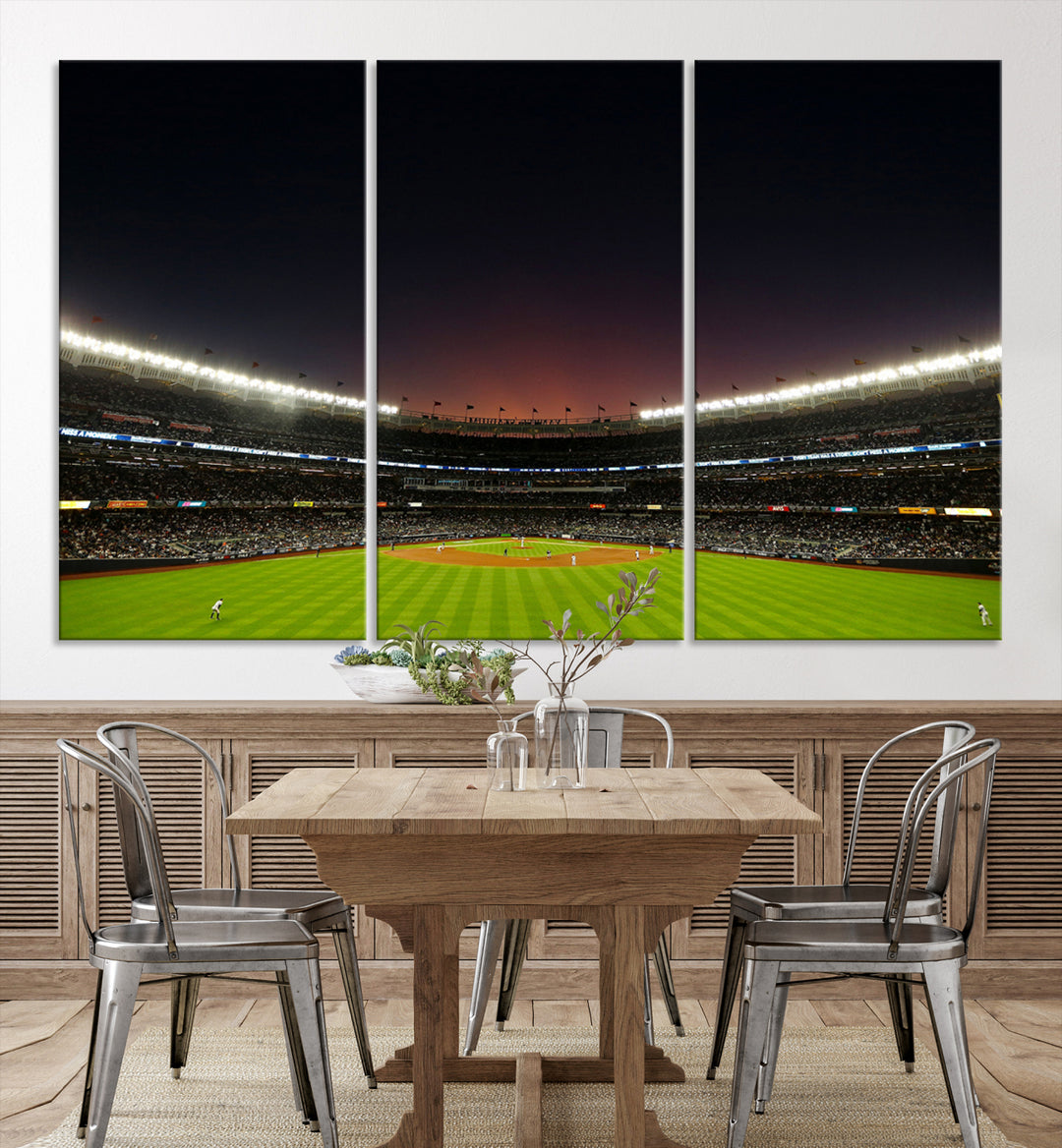 A night game at Yankee Stadium depicted on canvas beneath a sunset sky.