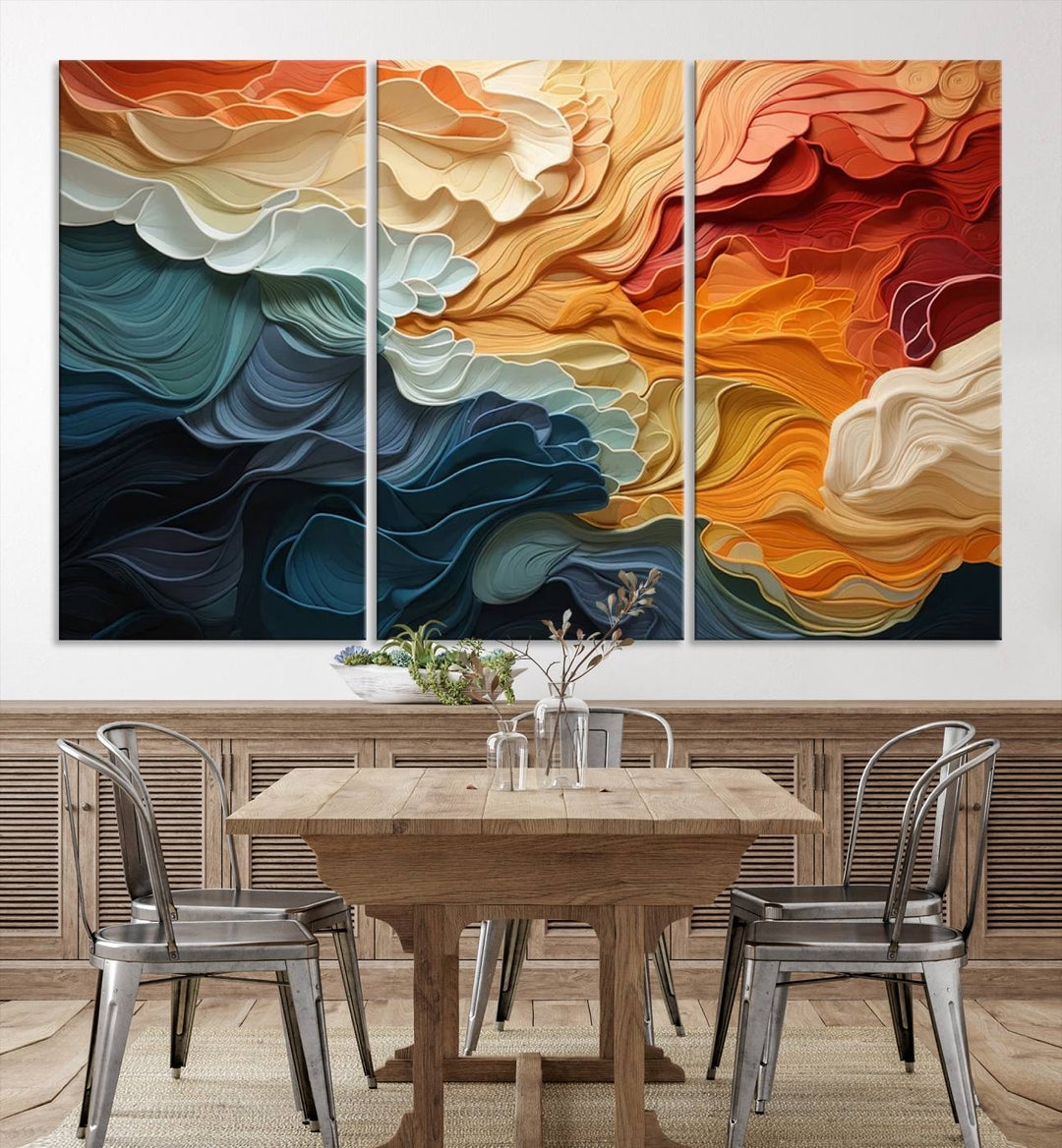 A Blue Orange Abstract Wave Wall Art Canvas Print adorns the wall. This colorful masterpiece is professionally hand-assembled to enhance any space.