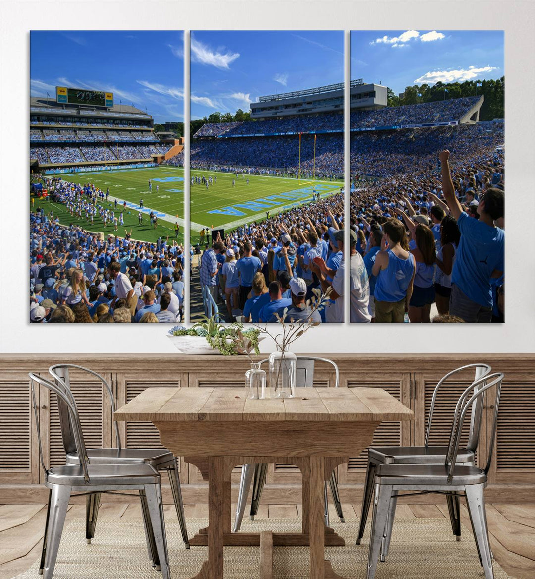 A gallery-quality canvas wall art print featuring the University of North Carolina Tar Heels Football Team and Chapel Hill's Kenan Memorial Stadium adorns the cafe wall.