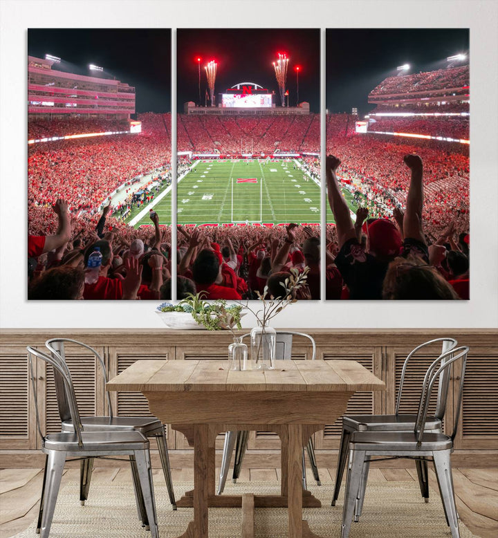 The University of Nebraska Cornhuskers Football Team Print, a vibrant three-panel canvas depicting Lincoln Memorial Stadium filled with enthusiastic fans from the end zone perspective, features a gallery-quality finish.