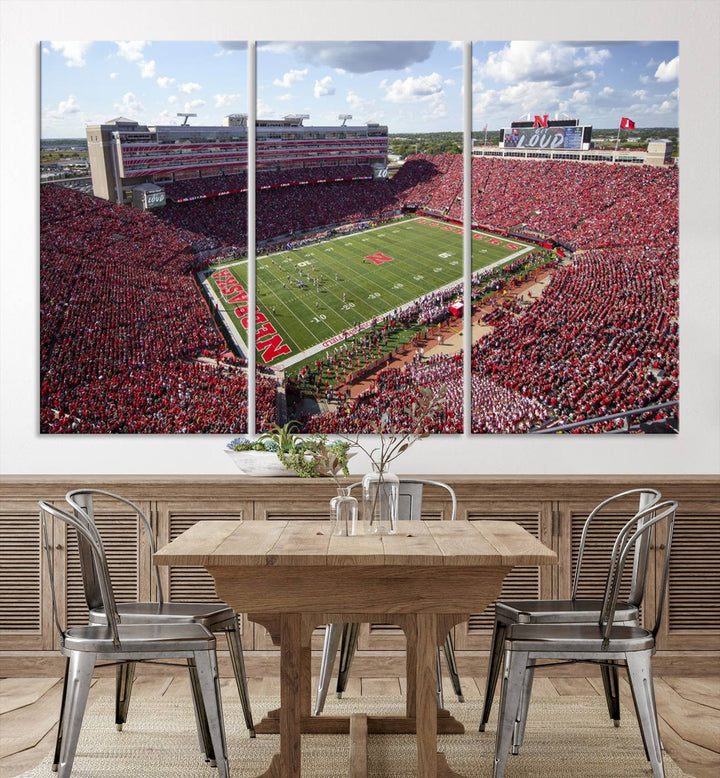 The University of Nebraska Cornhuskers Football Team Print showcases a vibrant triptych of Lincoln Memorial Stadium, depicting a packed football stadium filled with energetic fans. This handmade art piece is crafted in the USA and printed on premium canvas for a gallery-quality finish.