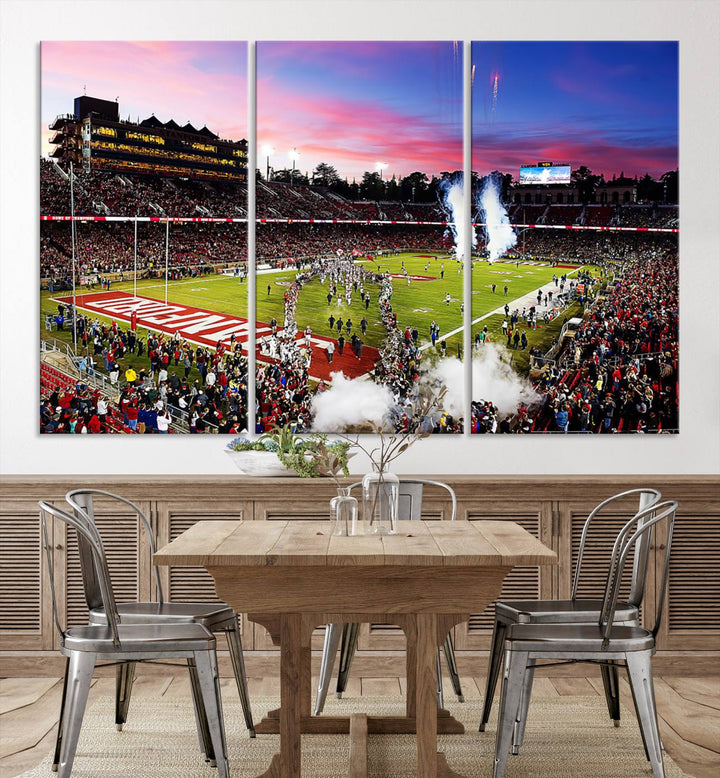 The wall art features a canvas print of the Stanford Cardinal football team, capturing players, fireworks, and smoke against the backdrop of a sunset at Stanford Stadium.