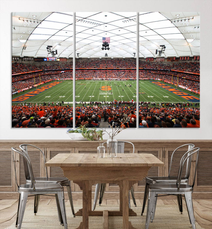 Fans fill the Syracuse JMA Wireless Dome, highlighted in orange and blue under a vaulted roof on this premium canvas print of the scene.