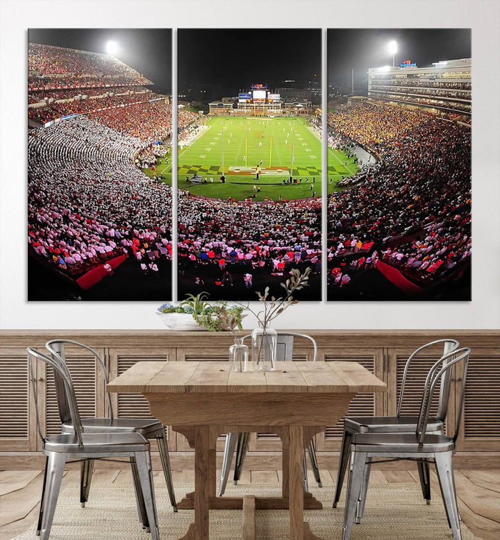 The Maryland Terrapins Football Wall Art Canvas showcases a packed SECU Stadium at night with a bright field and cheering fans.