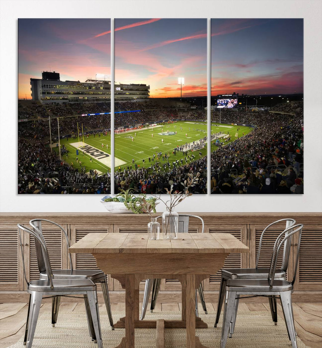 This wall art canvas print captures UCONN Huskies fans energizing a sunset scene at East Hartfords Pratt & Whitney Stadium.