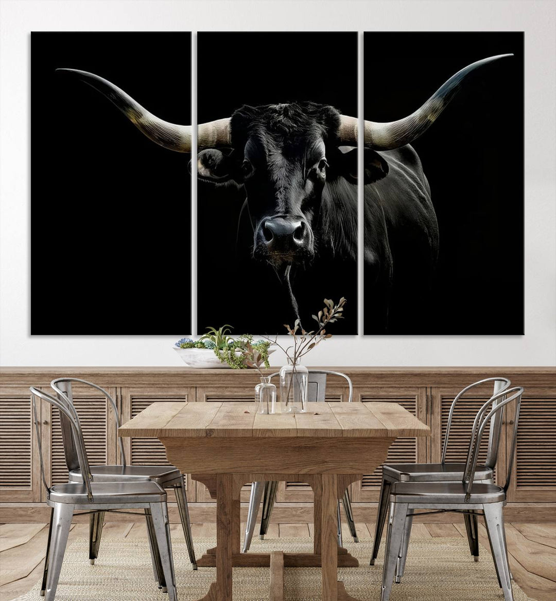 The Texas Black Longhorn Bull Canvas Print, featuring large curved horns set against a dark background, is ideal for Western decor.