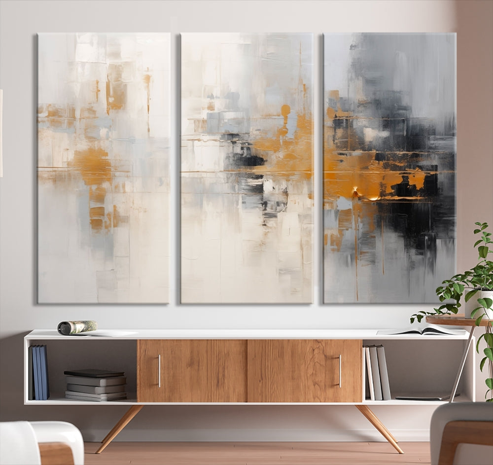 The Orange Pastel Abstract Wall Art Canvas Print, featuring a triptych of orange, white, and black hues, is elegantly displayed on museum-quality canvas.