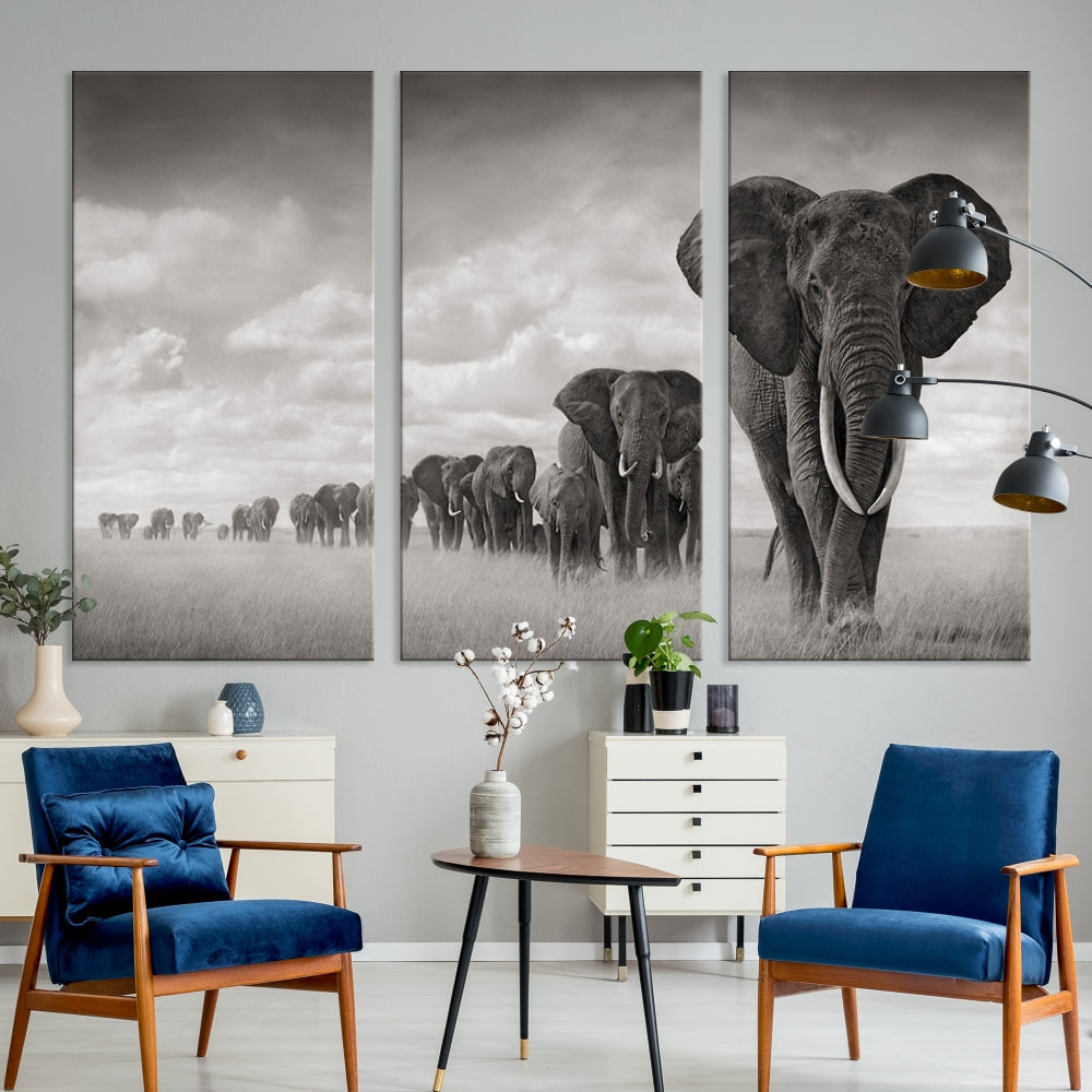 The Elephant Wall Art Canvas Print features a triptych of elephants in a savanna, elegantly displayed.