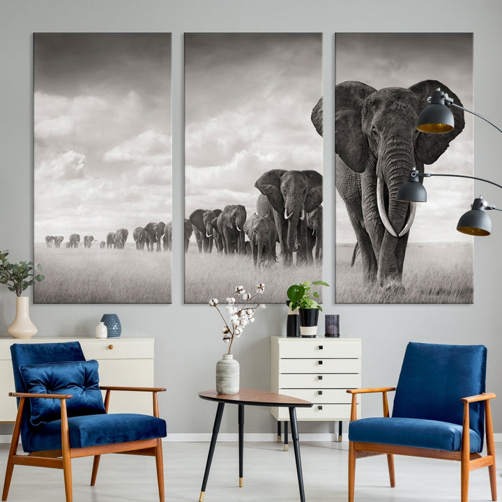 The "Herd of Elephants Wall Art Canvas Print" features an elegant black and white triptych of elephants walking in a line, beautifully displayed on museum-quality canvas with a UV-protective coating. This artwork arrives ready to hang and adds sophistication to any space.