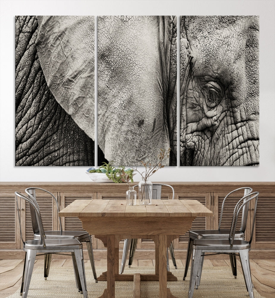 A modern living room features a large Elephant Wall Art Canvas Print in black and white, crafted on museum-quality canvases with UV-protective coating to maintain its elegance.