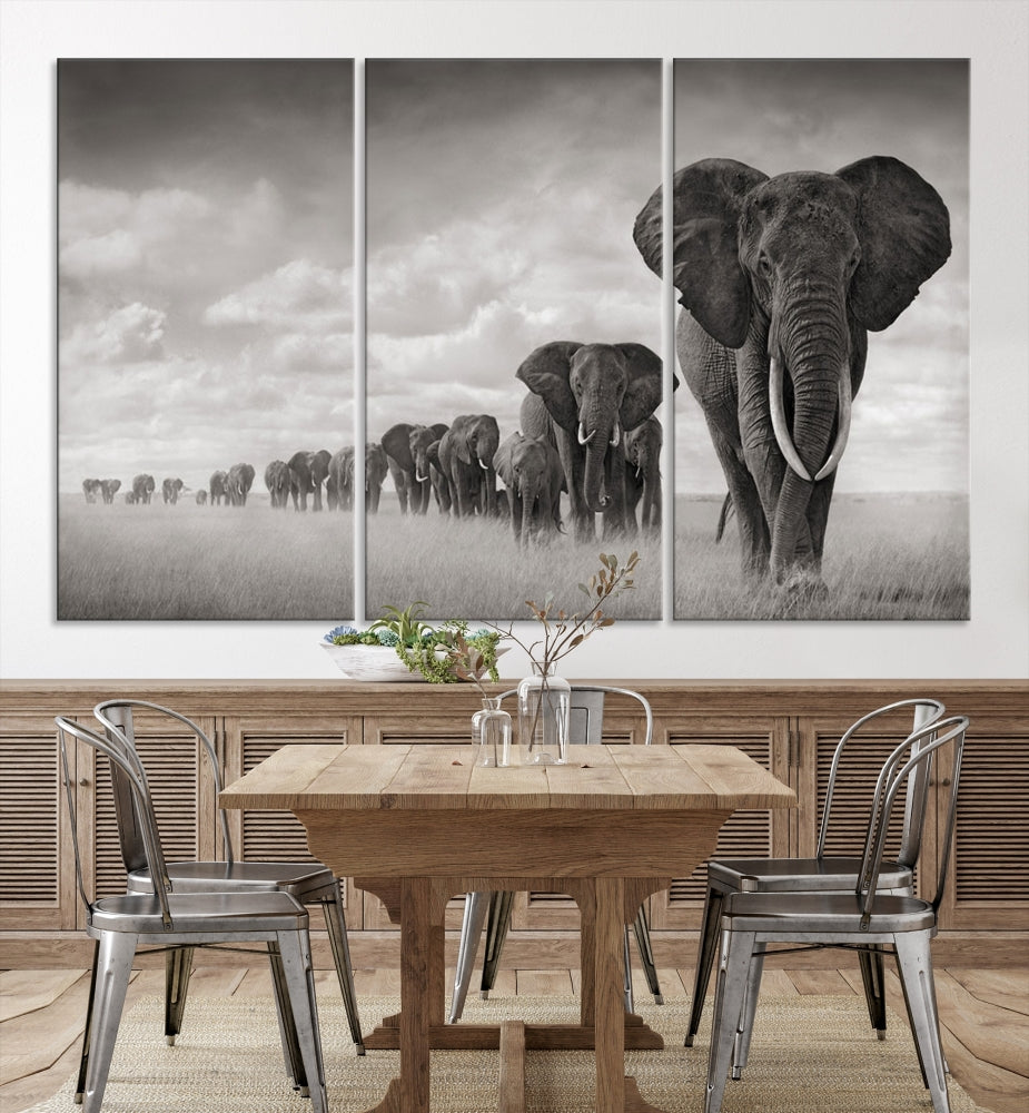 The Elephant Wall Art Canvas Print features a triptych of elephants in a savanna, elegantly displayed.