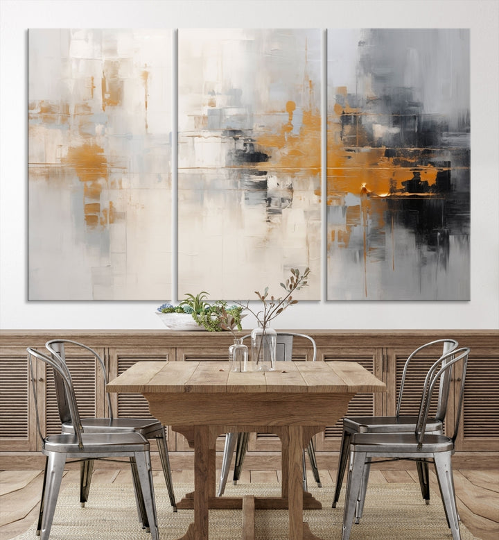 The Orange Pastel Abstract Wall Art Canvas Print, featuring a triptych of orange, white, and black hues, is elegantly displayed on museum-quality canvas.