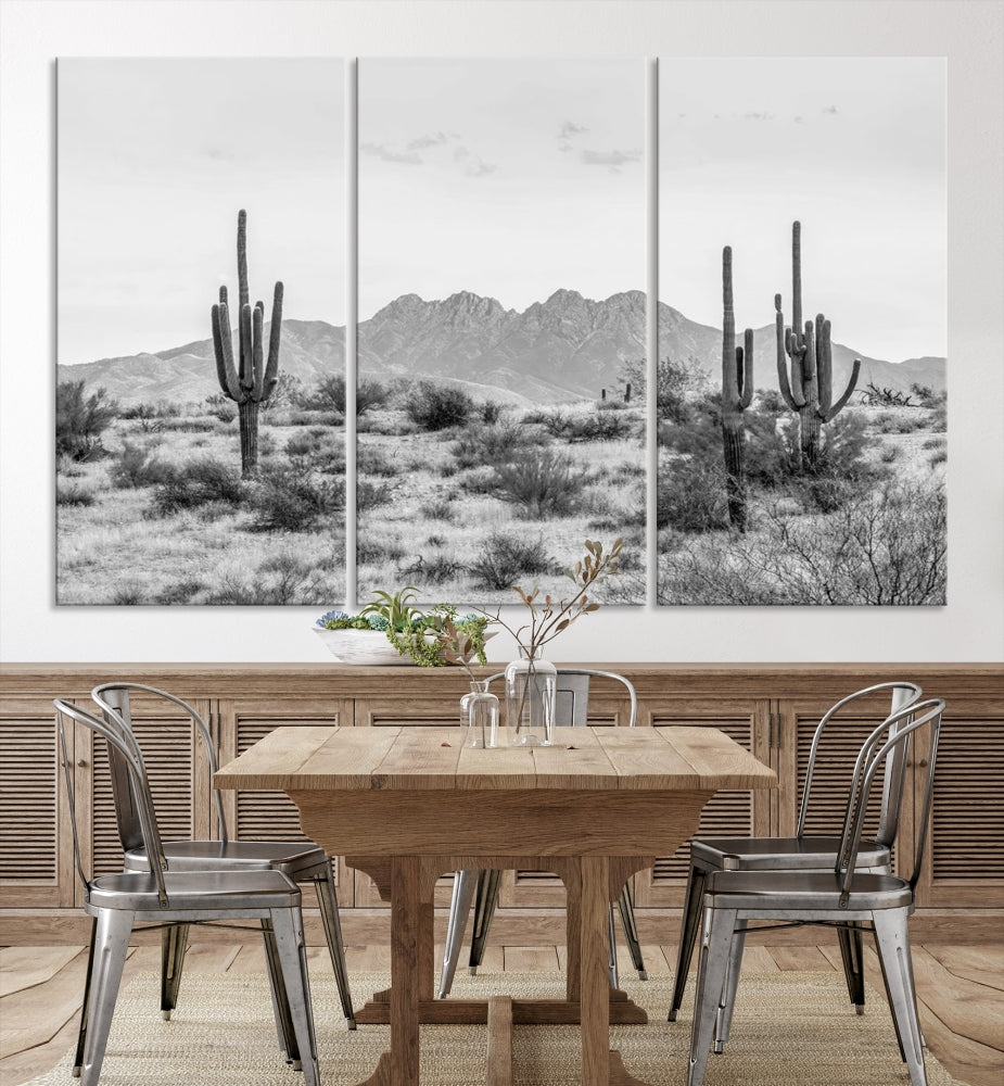 The modern living room showcases the "Black White Arizona Desert Canvas Wall Art Cactus Farmhouse Wall Art," a triptych consisting of gallery-wrapped, museum-quality black-and-white desert landscape photographs featuring cacti.